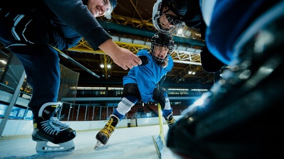 Ice hockey players training on a rink