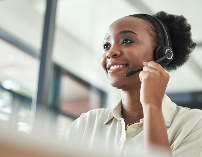 Customer support representative wearing a headset.