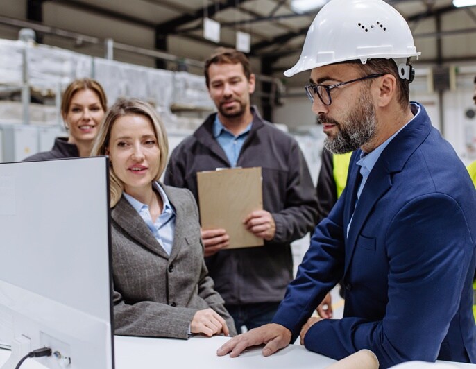 Team reviewing operations data in an industrial facility.