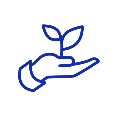Hand holding plant representing sustainability